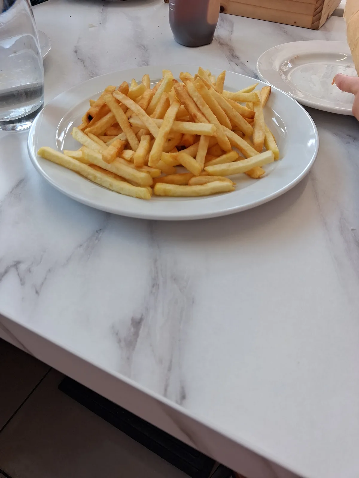 A plate of chips on a table at the diner